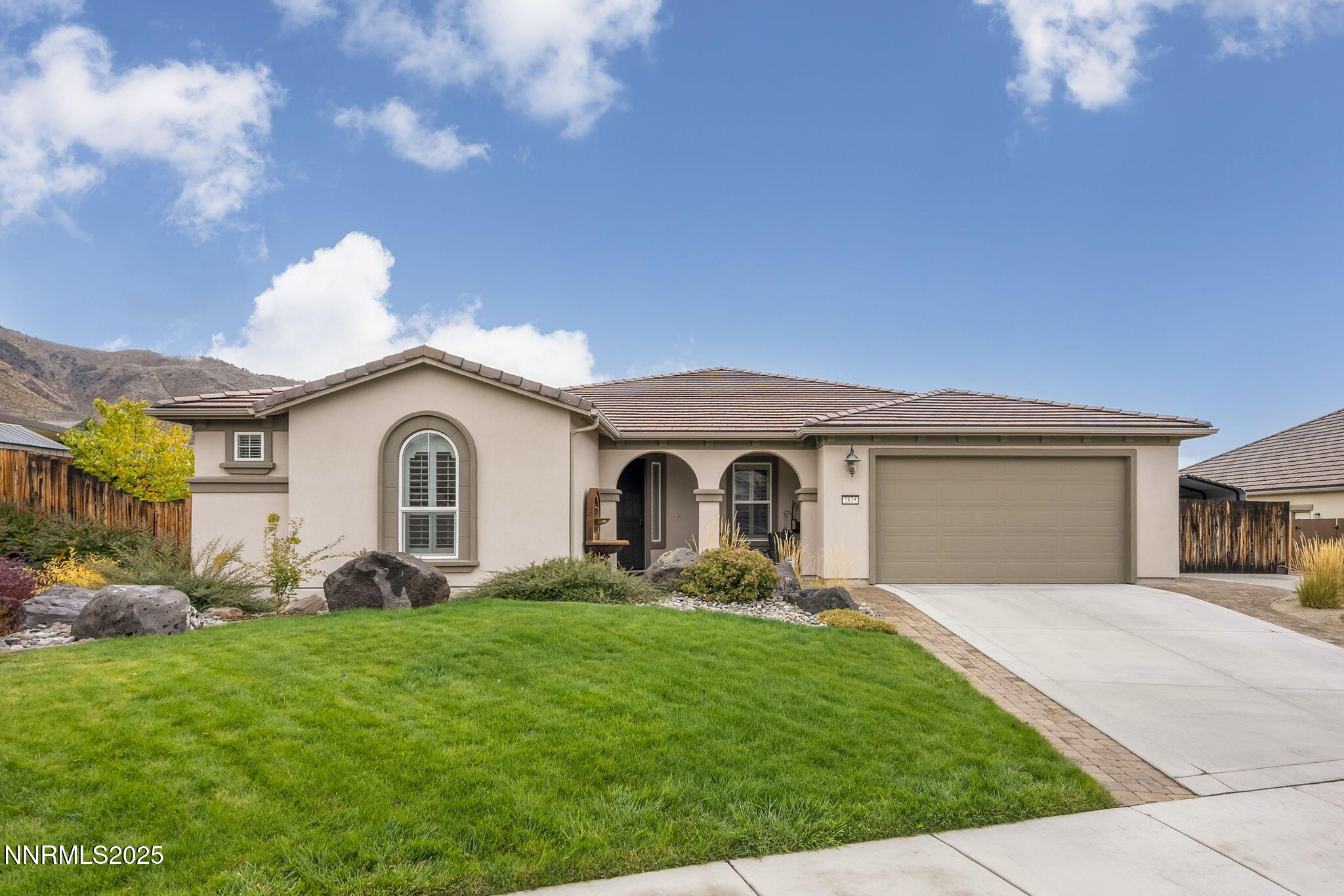 2835 Tobiano Drive Reno, NV 89521 - Photo 1 of 33 a front view of a house with garden