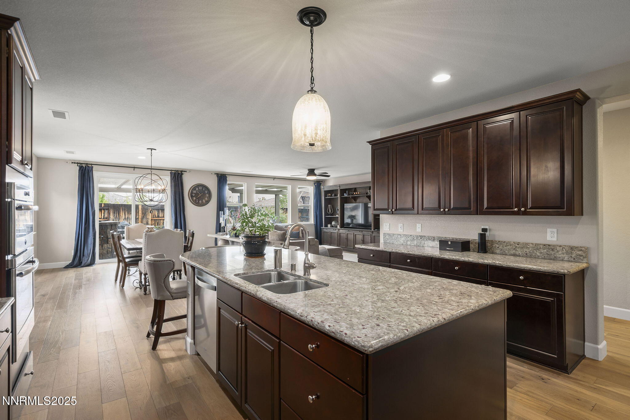 2835 Tobiano Drive Reno, NV 89521 - Photo 12 of 33 a kitchen with center island table and chairs in it