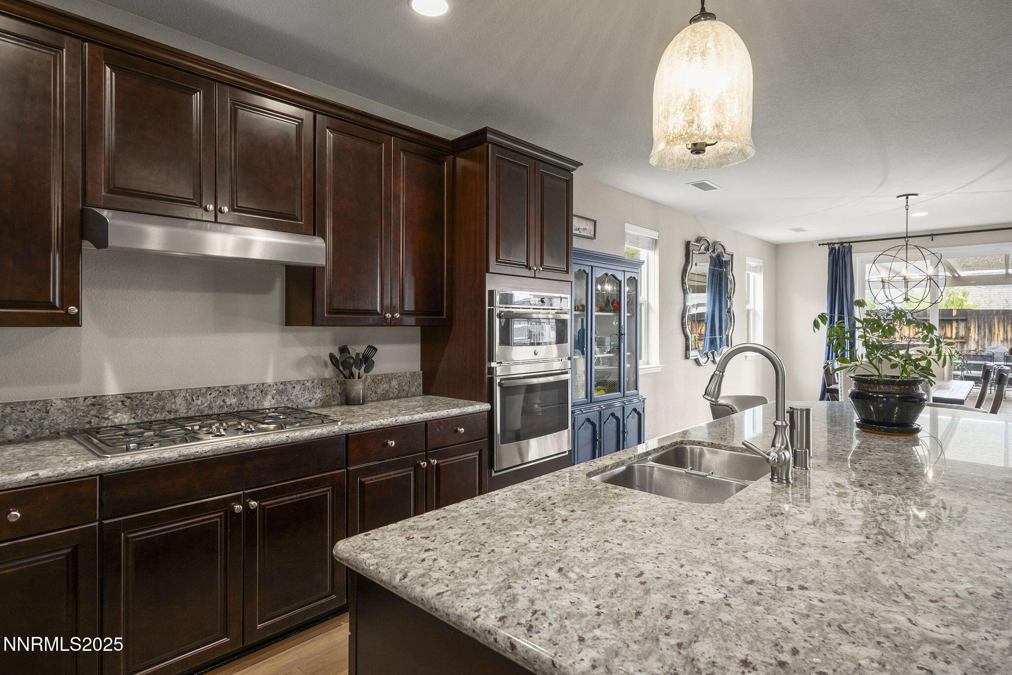2835 Tobiano Drive Reno, NV 89521 - Photo 13 of 33 a kitchen with stainless steel appliances granite countertop a sink stove and refrigerator