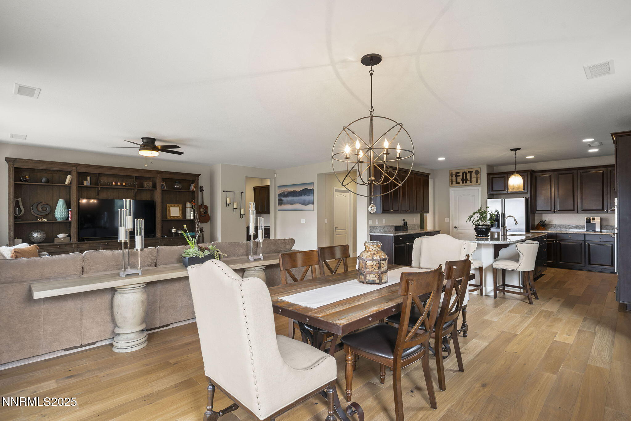 2835 Tobiano Drive Reno, NV 89521 - Photo 17 of 33 a view of a dining room with furniture window and wooden floor