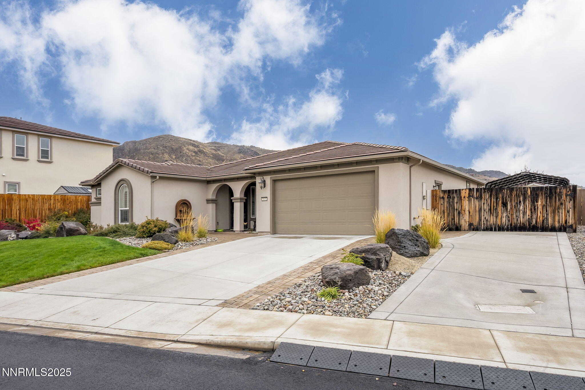 2835 Tobiano Drive Reno, NV 89521 - Photo 2 of 33 a front view of a house with garden