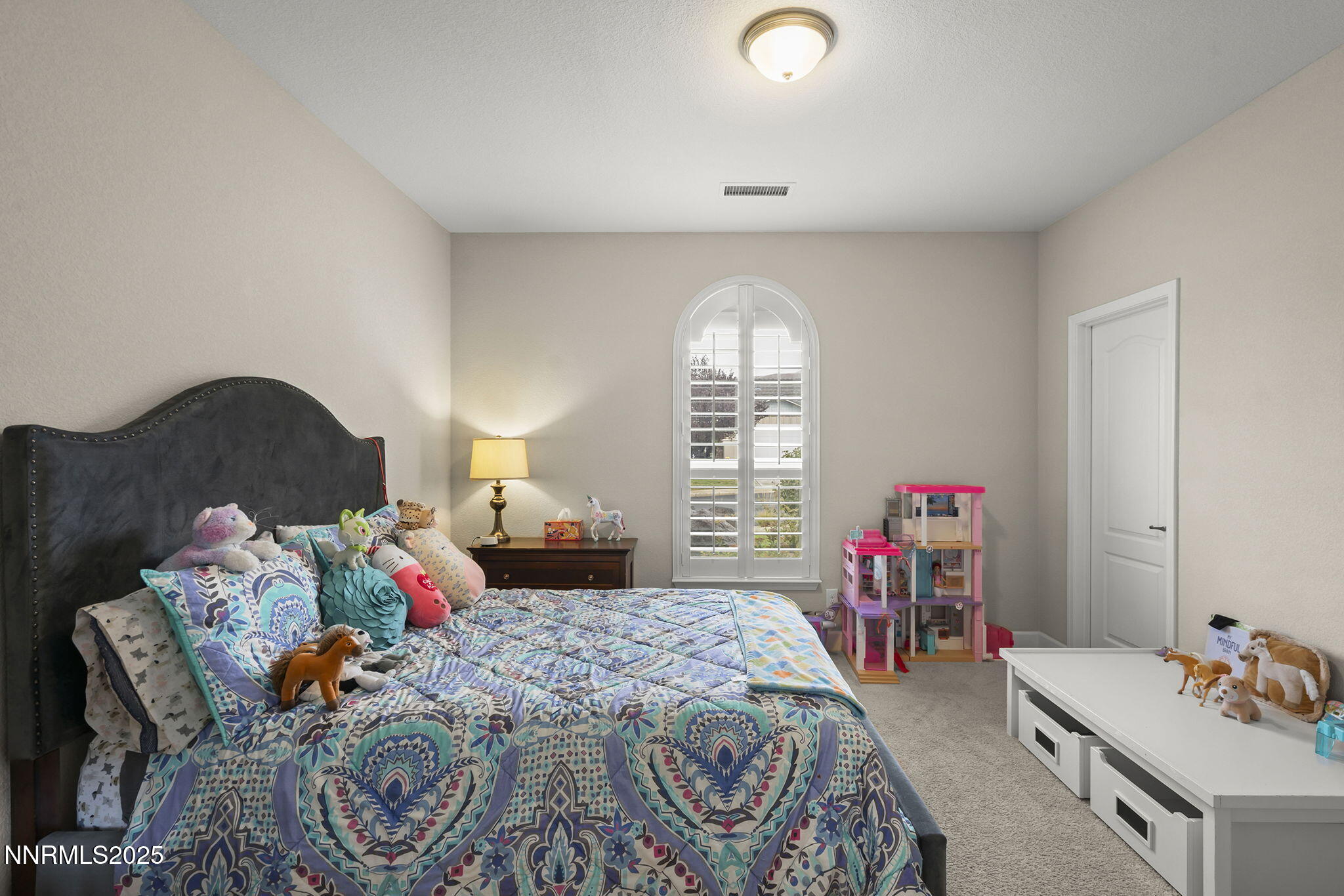 2835 Tobiano Drive Reno, NV 89521 - Photo 22 of 33 a bedroom with a bed and a window