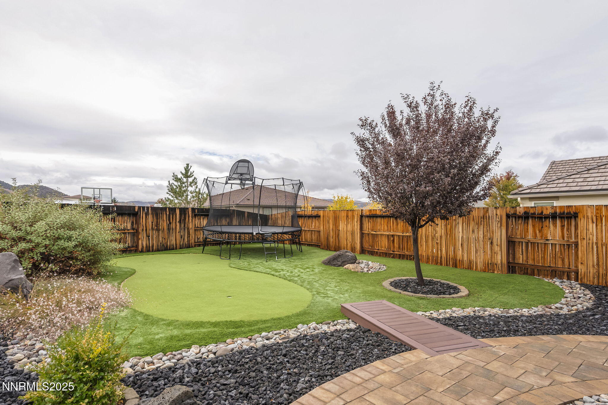 2835 Tobiano Drive Reno, NV 89521 - Photo 32 of 33 a view of a house with a yard and hanging chair