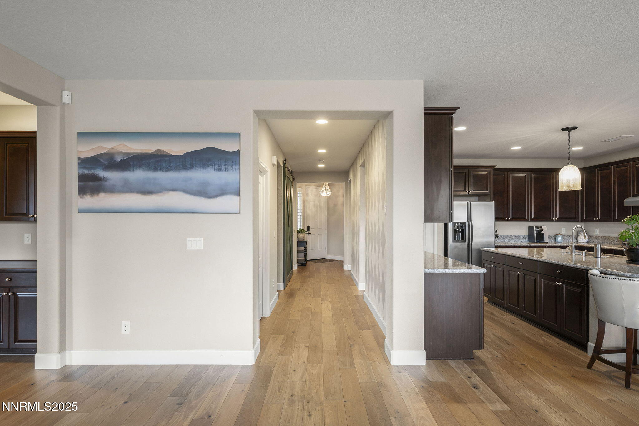 2835 Tobiano Drive Reno, NV 89521 - Photo 9 of 33 a view of a kitchen with a refrigerator and a microwave