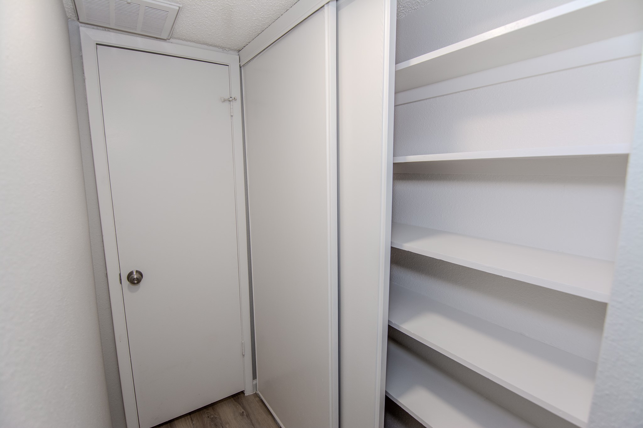 13009 Wirevine Lane Houston, TX 77072 - Photo 10 of 18 Storage closet with built-in shelves on the right, ideal for storage in a compact space.