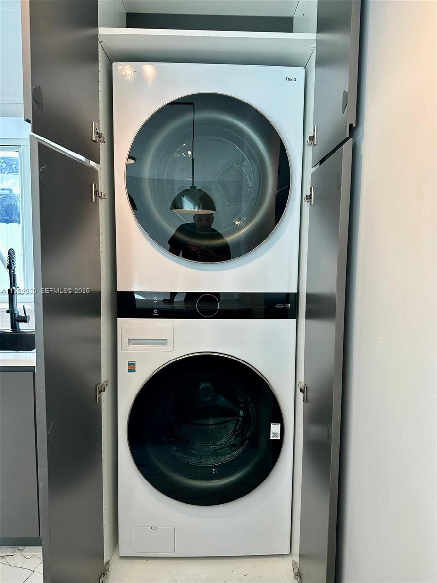 629 Southwest 4th Street Hallandale Beach, FL 33009 - Photo 11 of 27 a utility room with washing machine