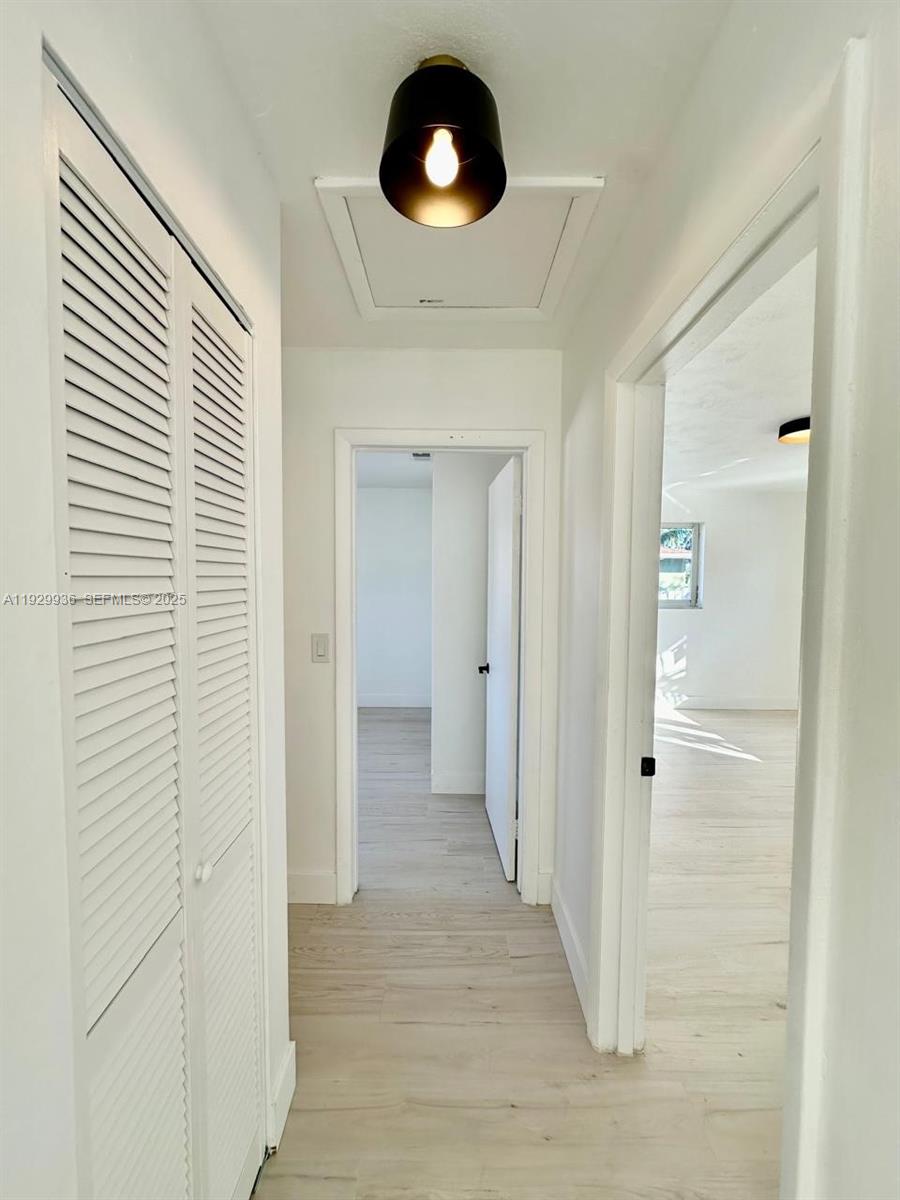 629 Southwest 4th Street Hallandale Beach, FL 33009 - Photo 17 of 27 a view of a hallway with wooden floor
