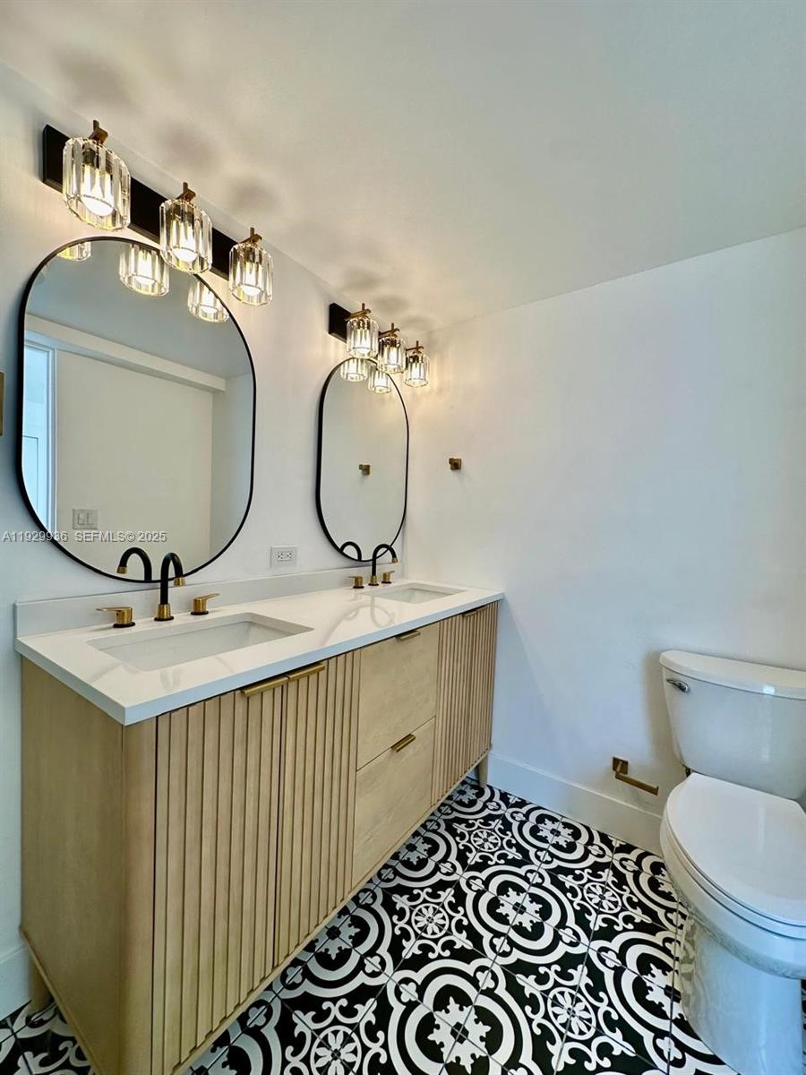 629 Southwest 4th Street Hallandale Beach, FL 33009 - Photo 20 of 27 a bathroom with a sink and mirror