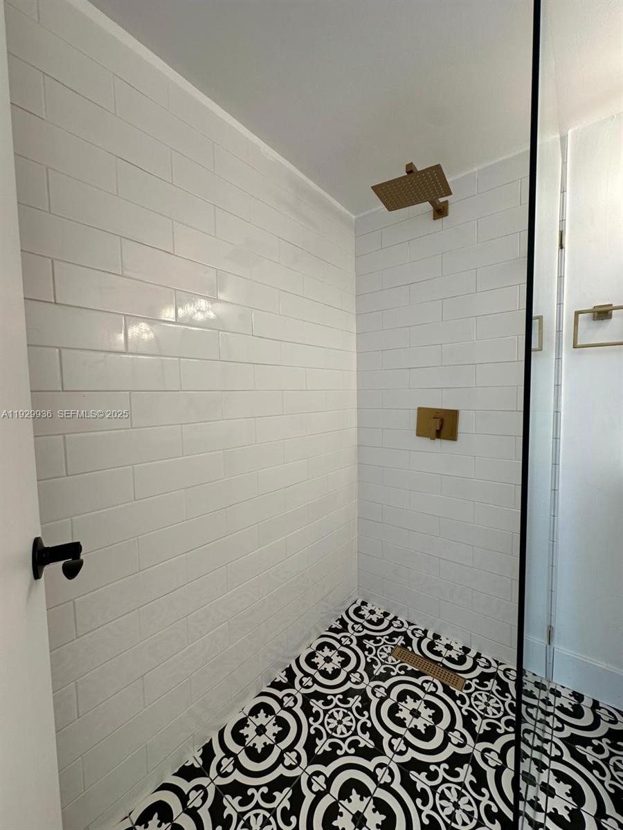 629 Southwest 4th Street Hallandale Beach, FL 33009 - Photo 21 of 27 a bathroom with a shower