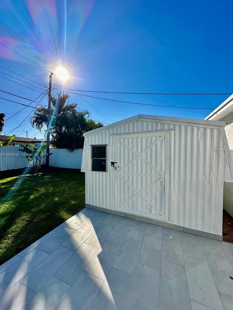 629 Southwest 4th Street Hallandale Beach, FL 33009 - Photo 27 of 27 a view of a backyard of the house