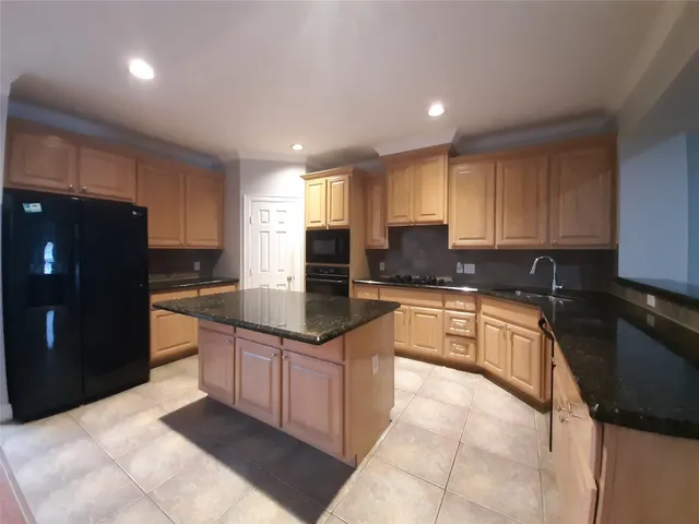 a view of a livingroom with a ceiling fan and window