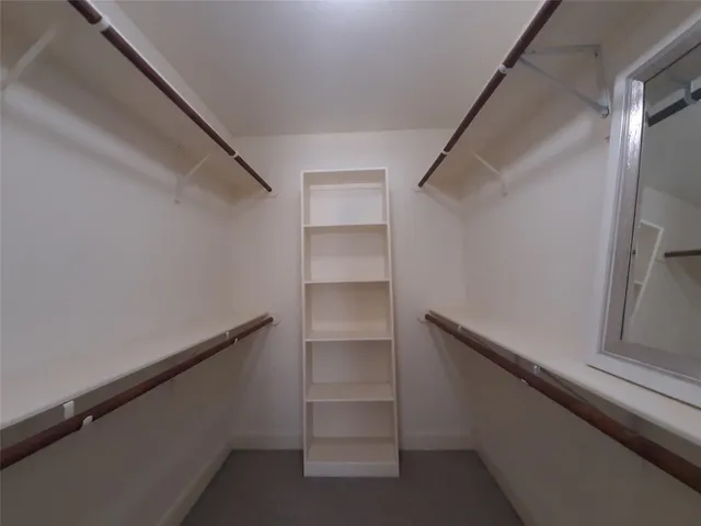 a view of an empty walk in closet