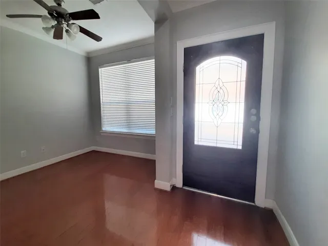 an empty room with a empty space and windows