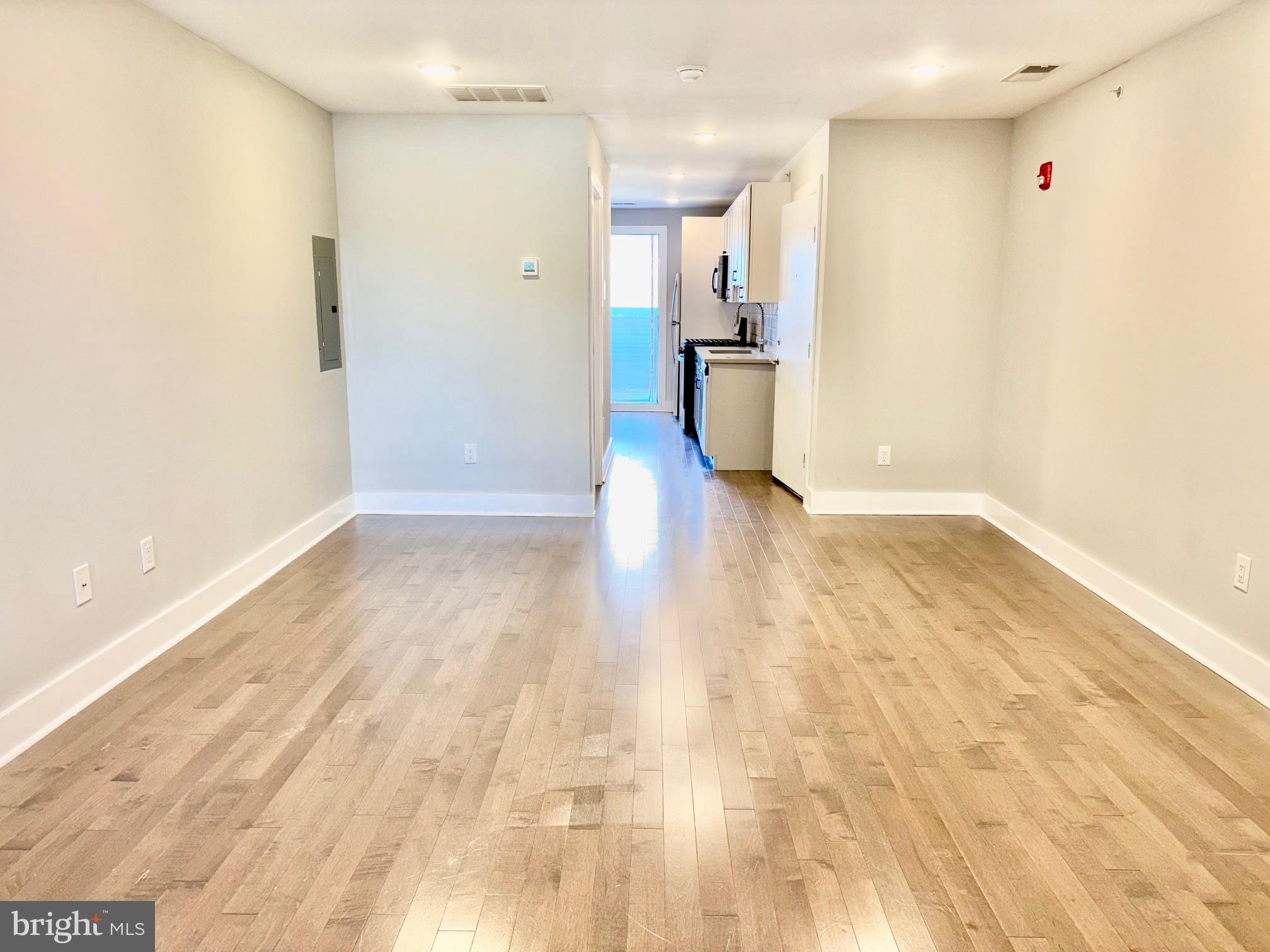 5334-36 Cedar Avenue, Unit 7G Philadelphia, PA 19143 - Photo 13 of 14 a view of empty room with wooden floor