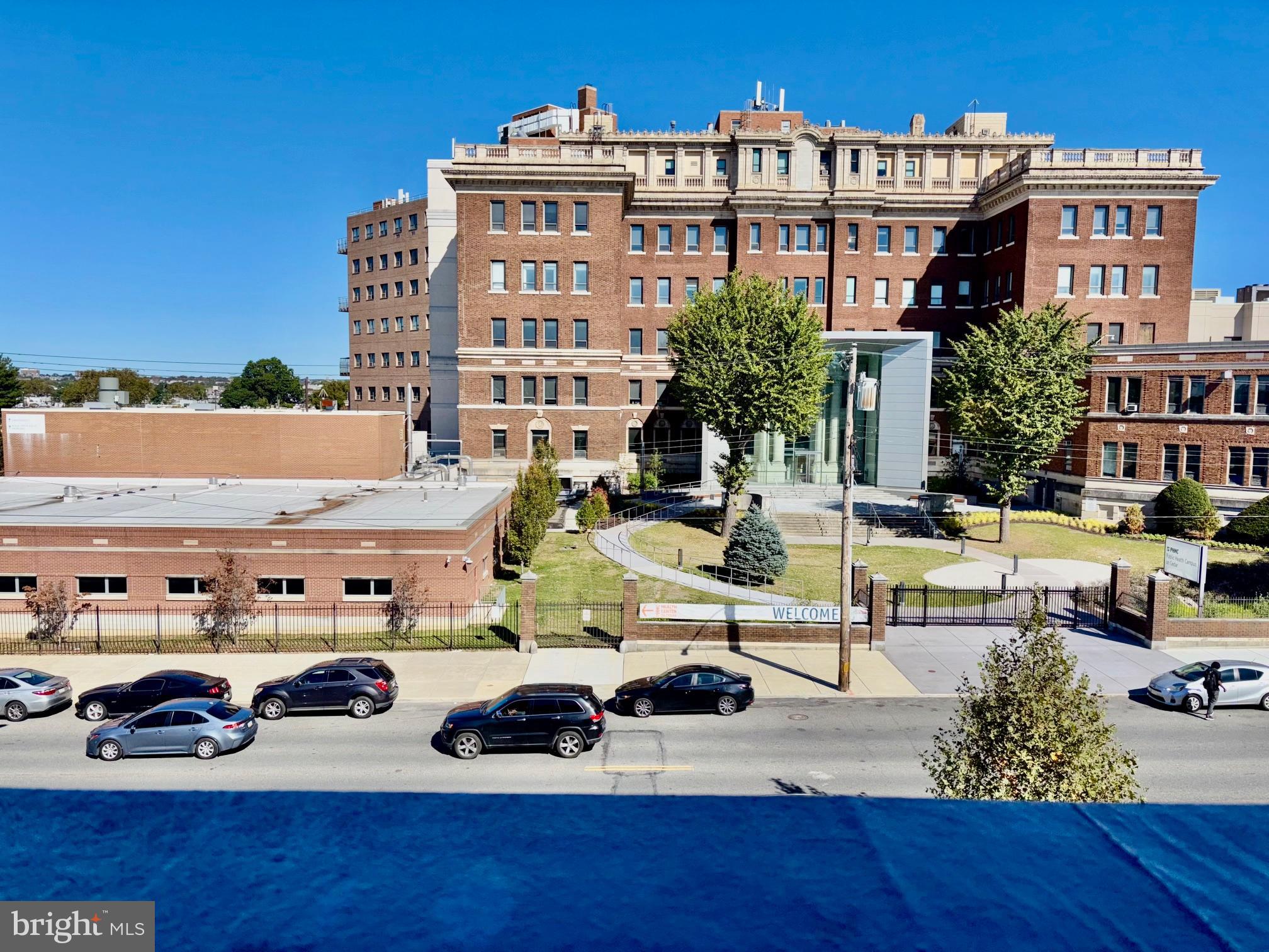5334-36 Cedar Avenue, Unit 7G Philadelphia, PA 19143 - Photo 4 of 14 a view of a building and car parked