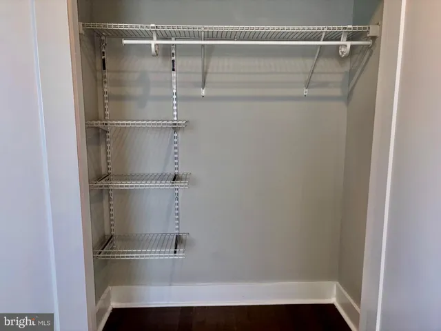 an empty room with wooden floor