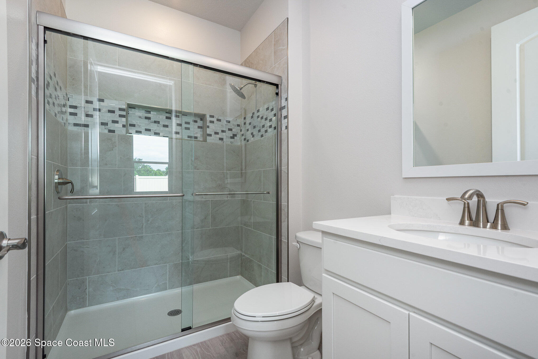 150 First Light Circle Cocoa, FL 32922 - Photo 15 of 28 a bathroom with a sink a toilet and shower