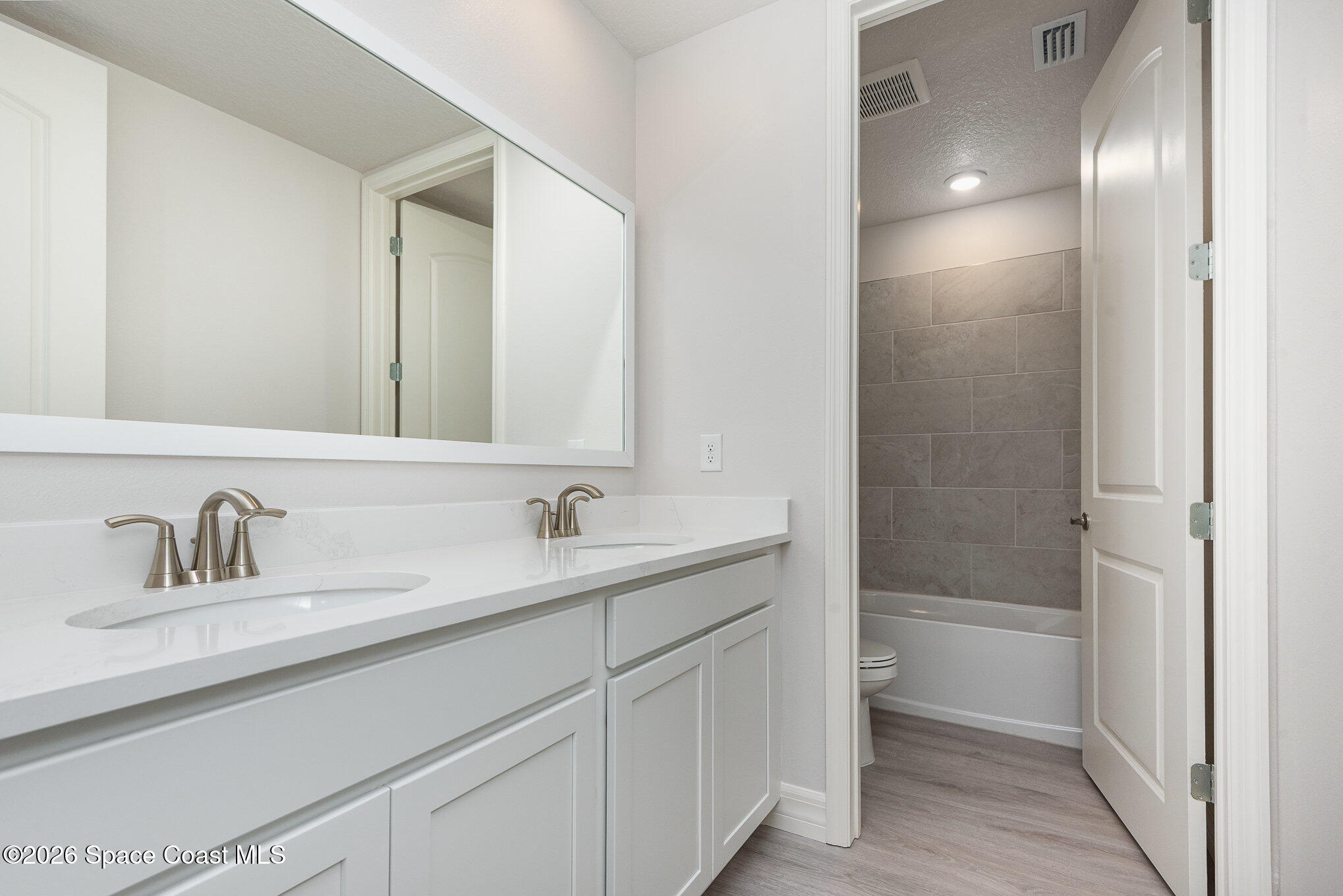 150 First Light Circle Cocoa, FL 32922 - Photo 25 of 28 a bathroom with a sink and a mirror