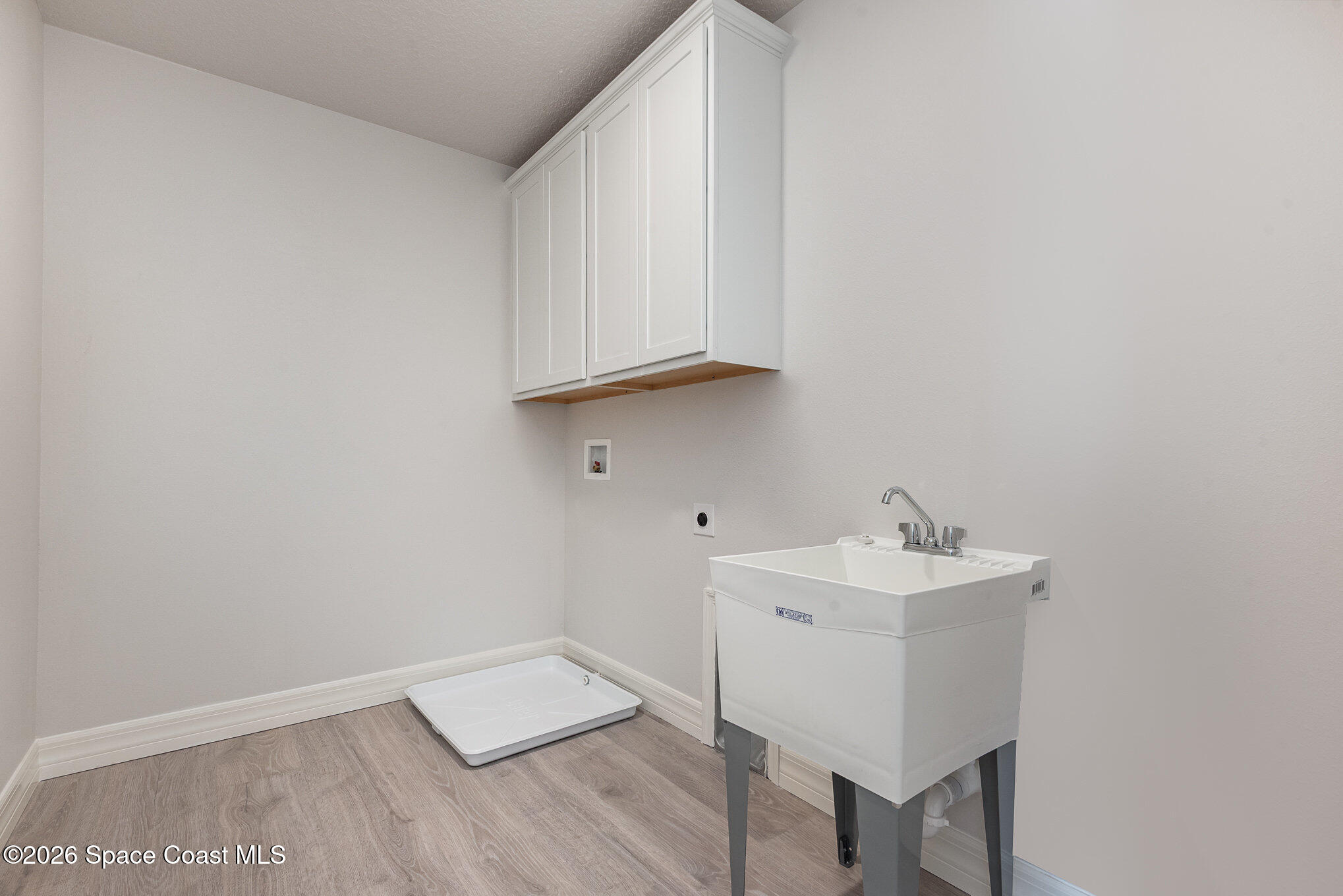 150 First Light Circle Cocoa, FL 32922 - Photo 26 of 28 a view of an empty room and wooden floor