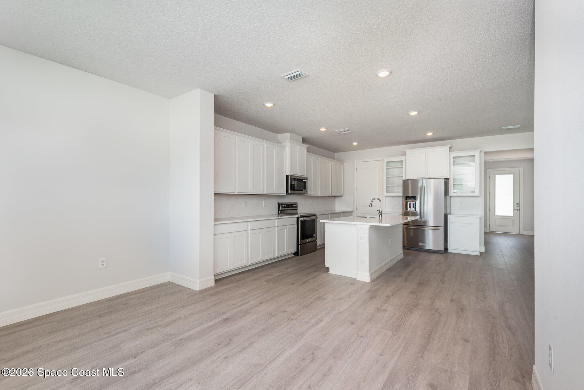 150 First Light Circle Cocoa, FL 32922 - Photo 7 of 28 a view of kitchen with wooden floor
