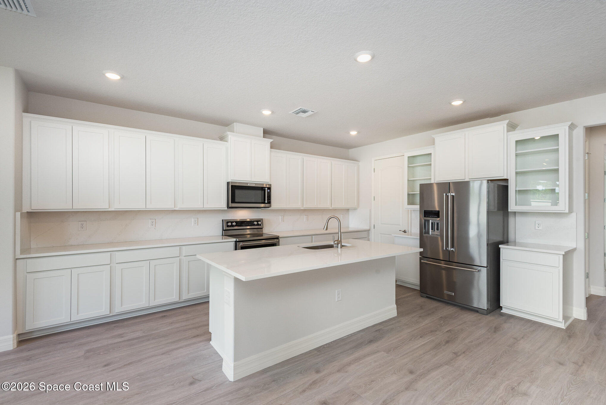 150 First Light Circle Cocoa, FL 32922 - Photo 8 of 28 a kitchen with stainless steel appliances a refrigerator sink and microwave