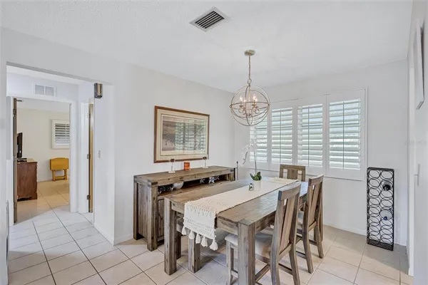 a bedroom with two beds and a window