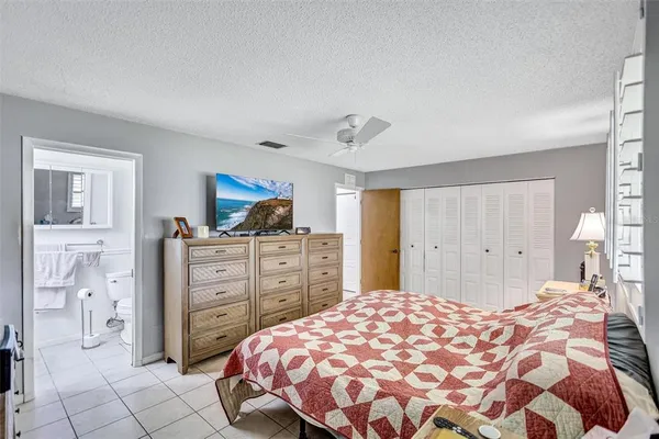 a view of a house with backyard and a tree