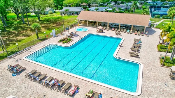 a blue swimming pool is in the middle of a lake