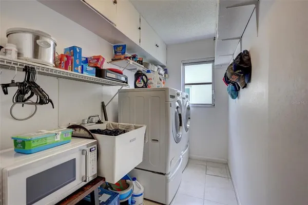 a storage & utility room with a window