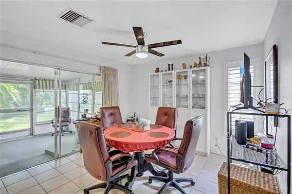 a view of a dining room with furniture window and outside view