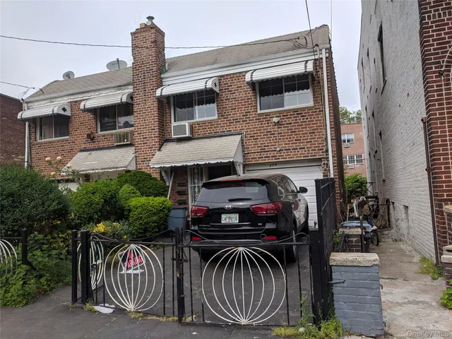 a view of a house with a balcony and furniture