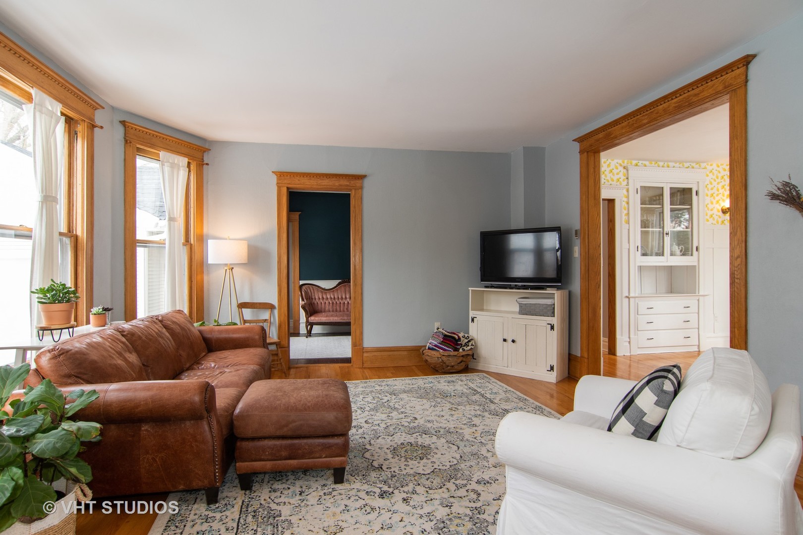 32-w028 Army Trail Road Wayne, IL 60184 - Photo 17 of 39 a living room with furniture a flat screen tv and a large window