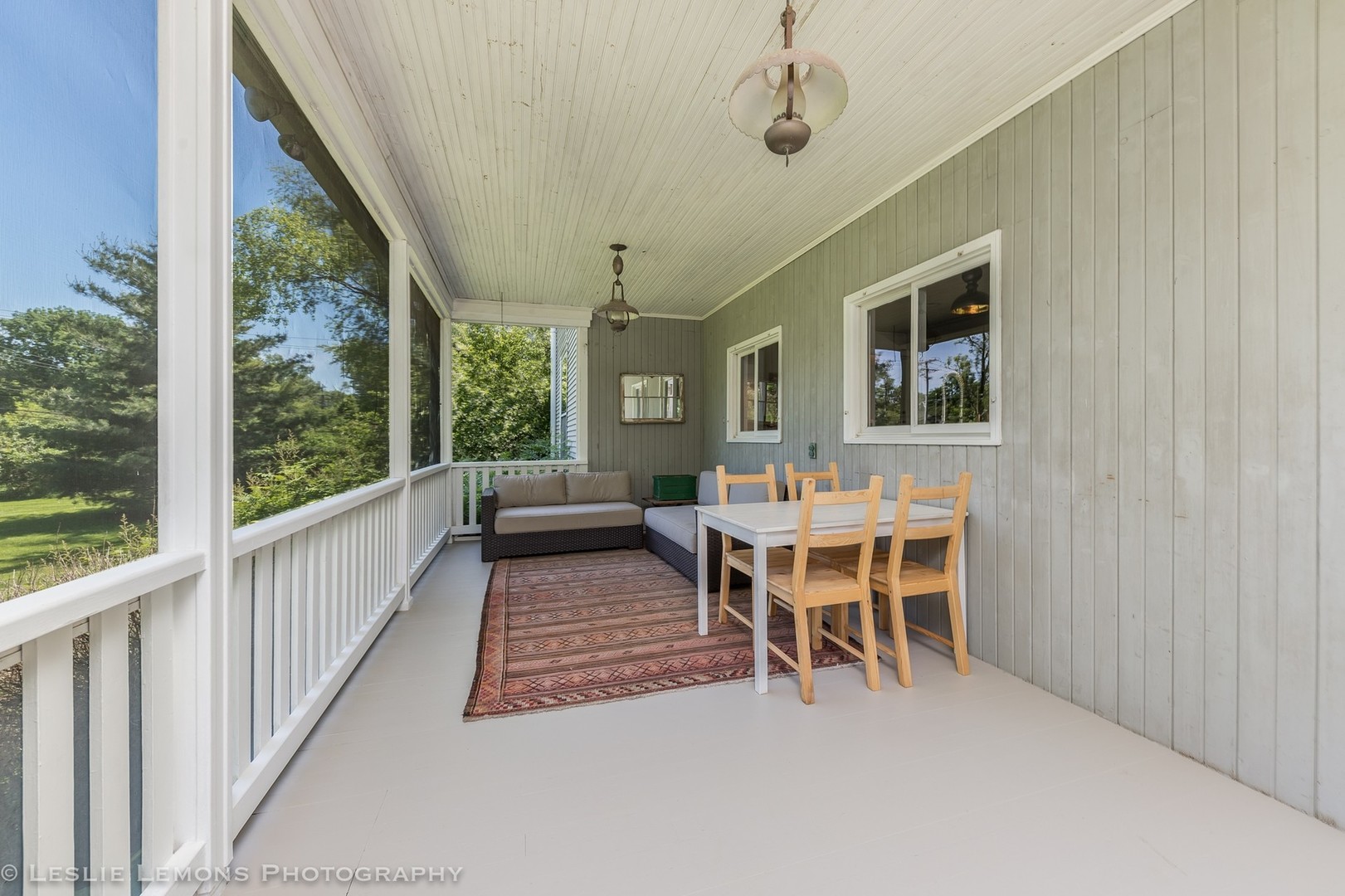 32-w028 Army Trail Road Wayne, IL 60184 - Photo 27 of 39 a dining room with wooden floor a chandelier a glass table and chairs