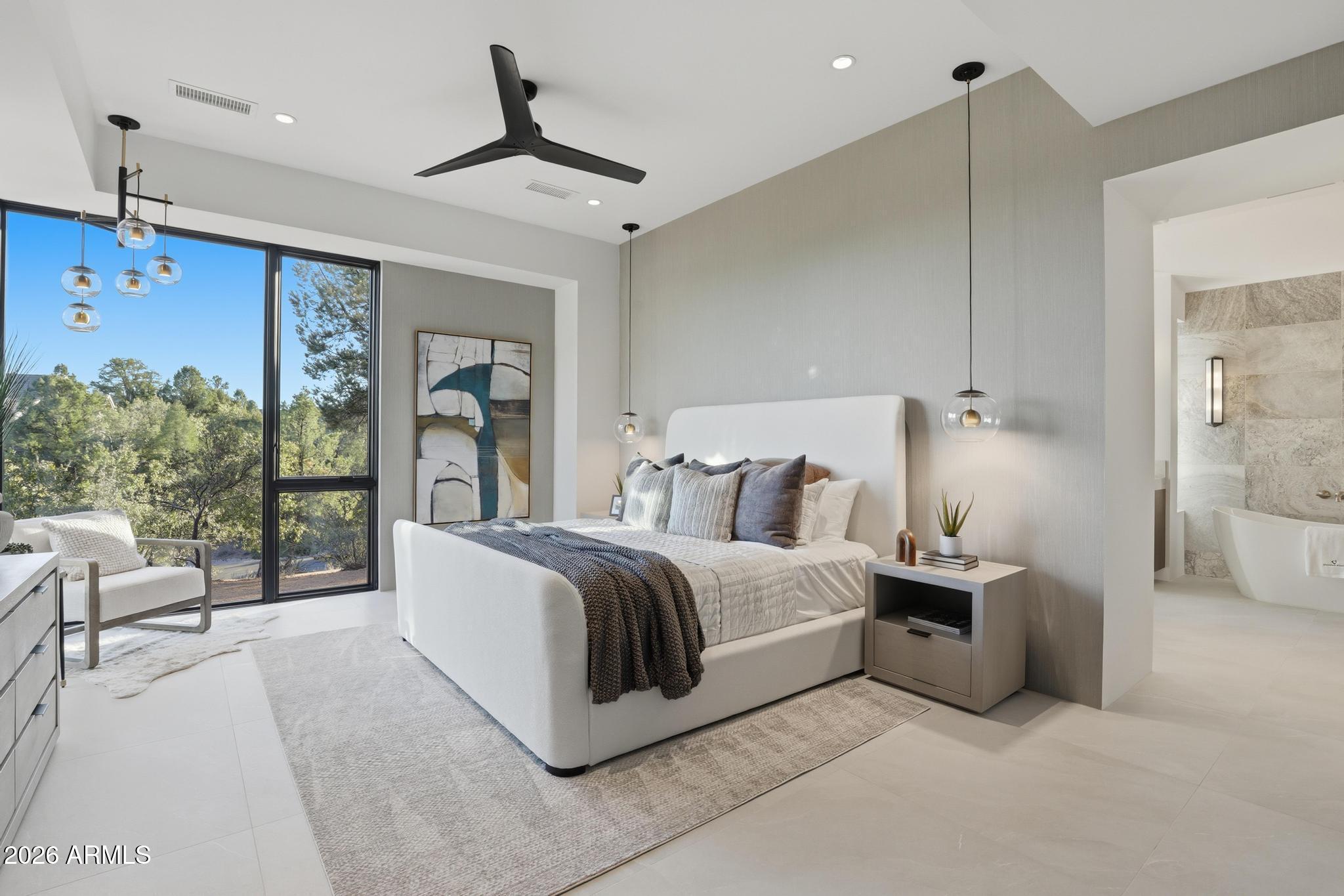 108 South Rim Club Drive Payson, AZ 85541 - Photo 14 of 56 a spacious bedroom with a bed and large window