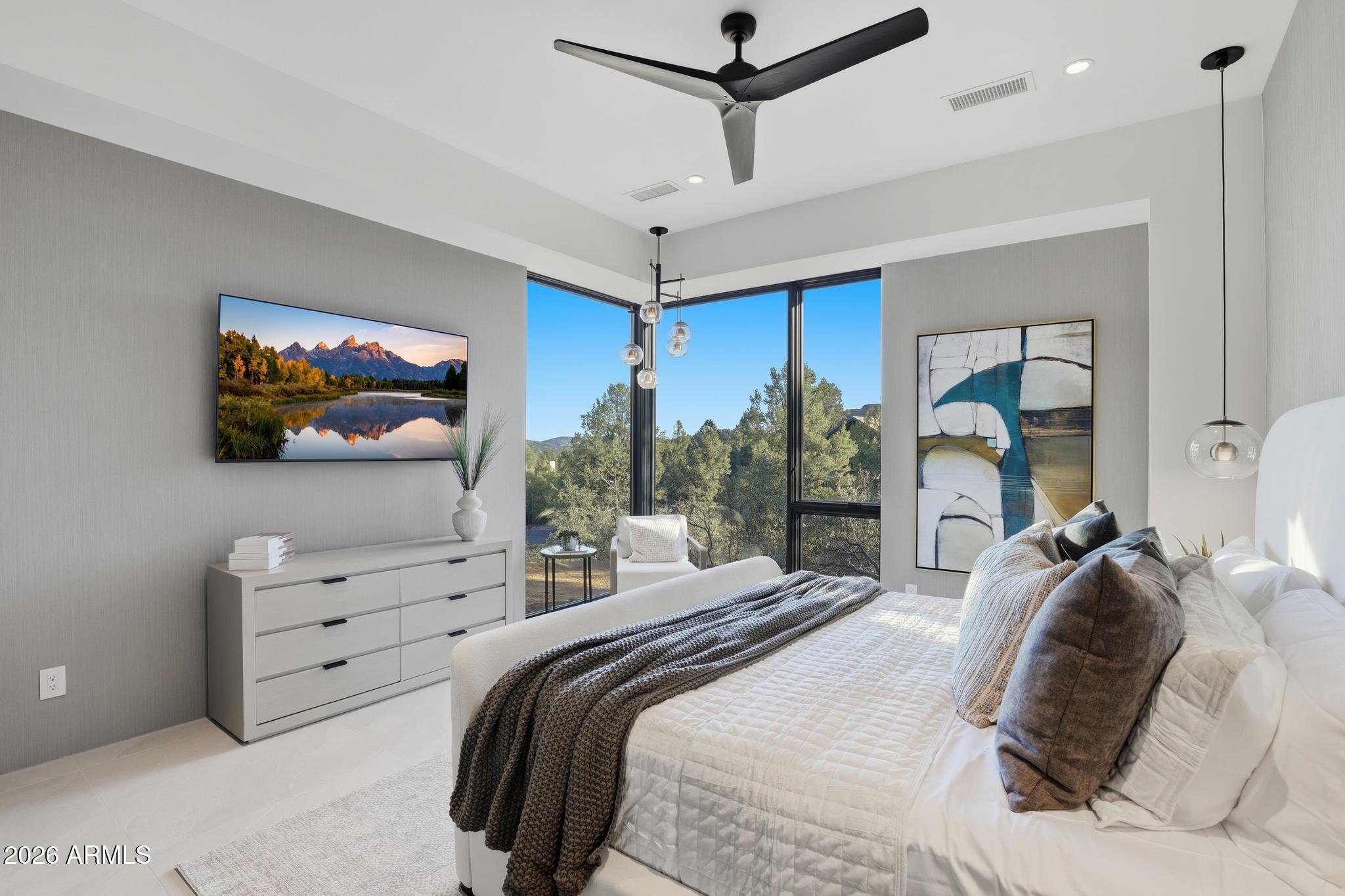108 South Rim Club Drive Payson, AZ 85541 - Photo 15 of 56 a bedroom with a large bed and a flat screen tv