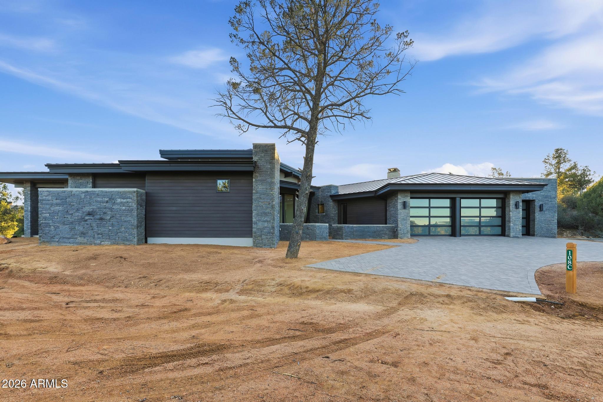108 South Rim Club Drive Payson, AZ 85541 - Photo 44 of 56 a front view of a house with a yard and garage