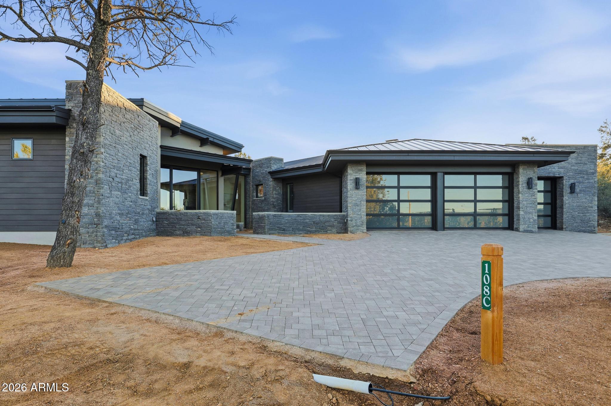 108 South Rim Club Drive Payson, AZ 85541 - Photo 45 of 56 a front view of a house with a yard and garage