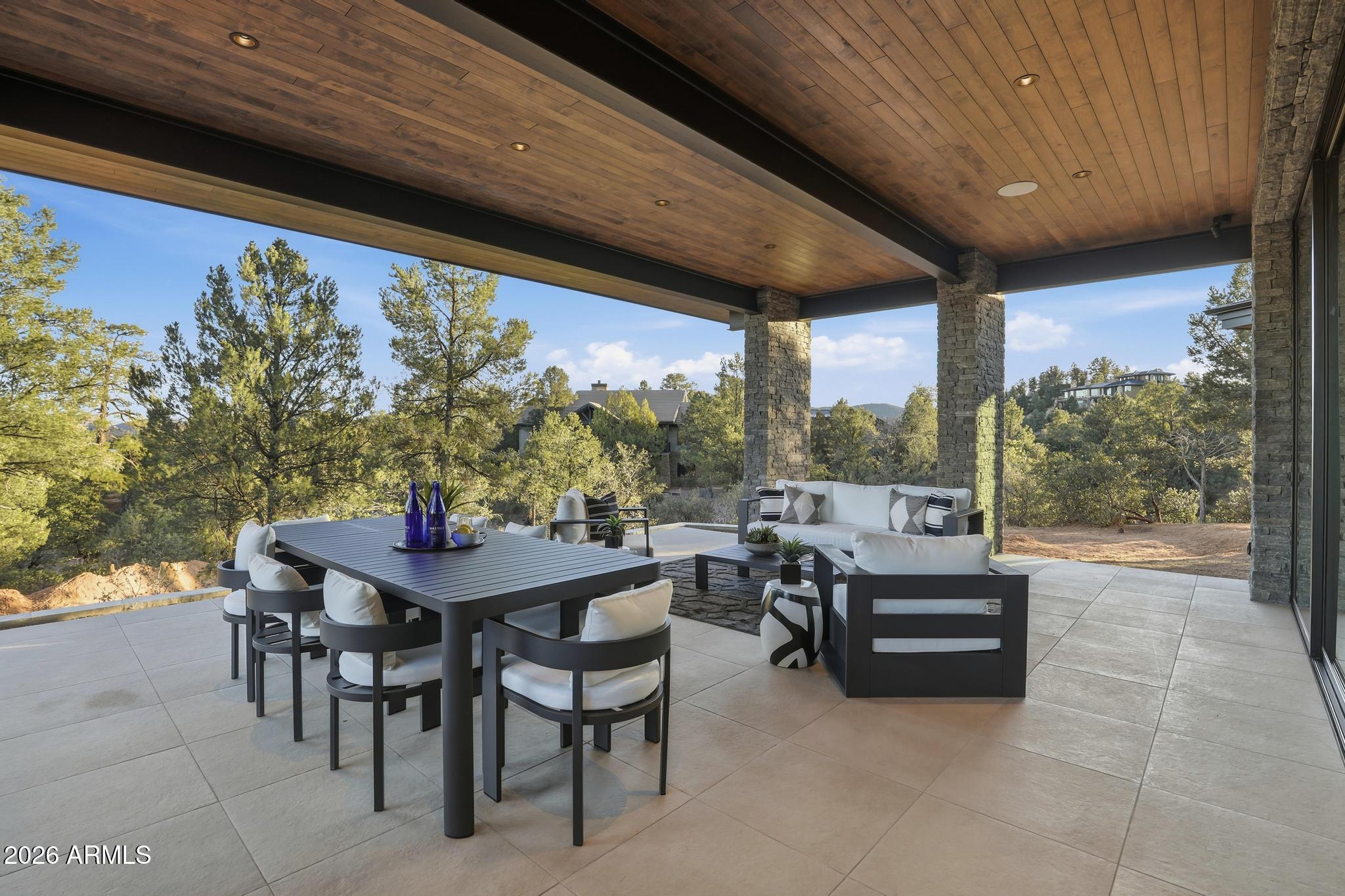 108 South Rim Club Drive Payson, AZ 85541 - Photo 51 of 56 a view of a patio with a dining table and chairs