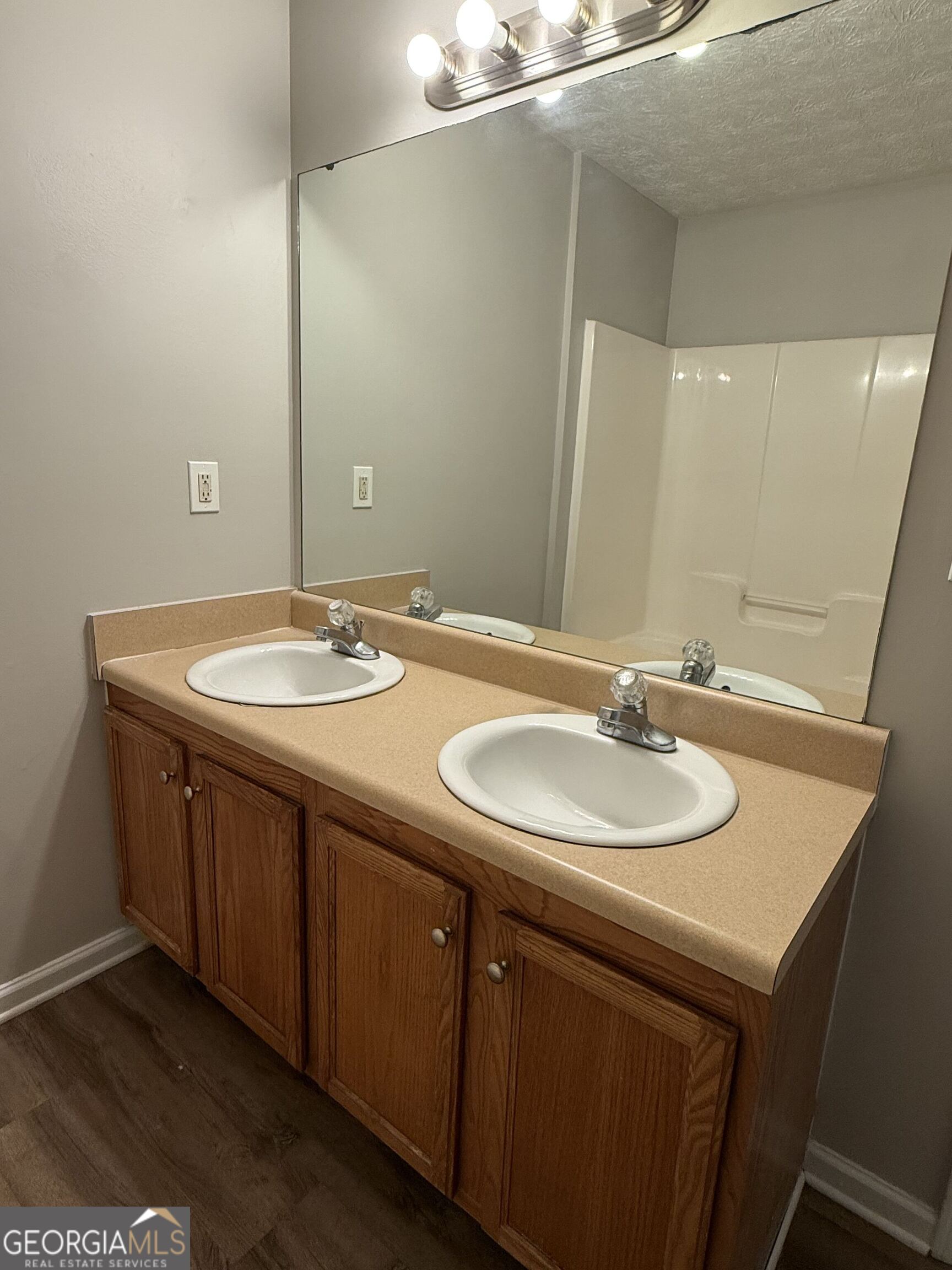 6132 Ruth Street Southwest Covington, GA 30014 - Photo 18 of 33 a bathroom with a sink and a mirror