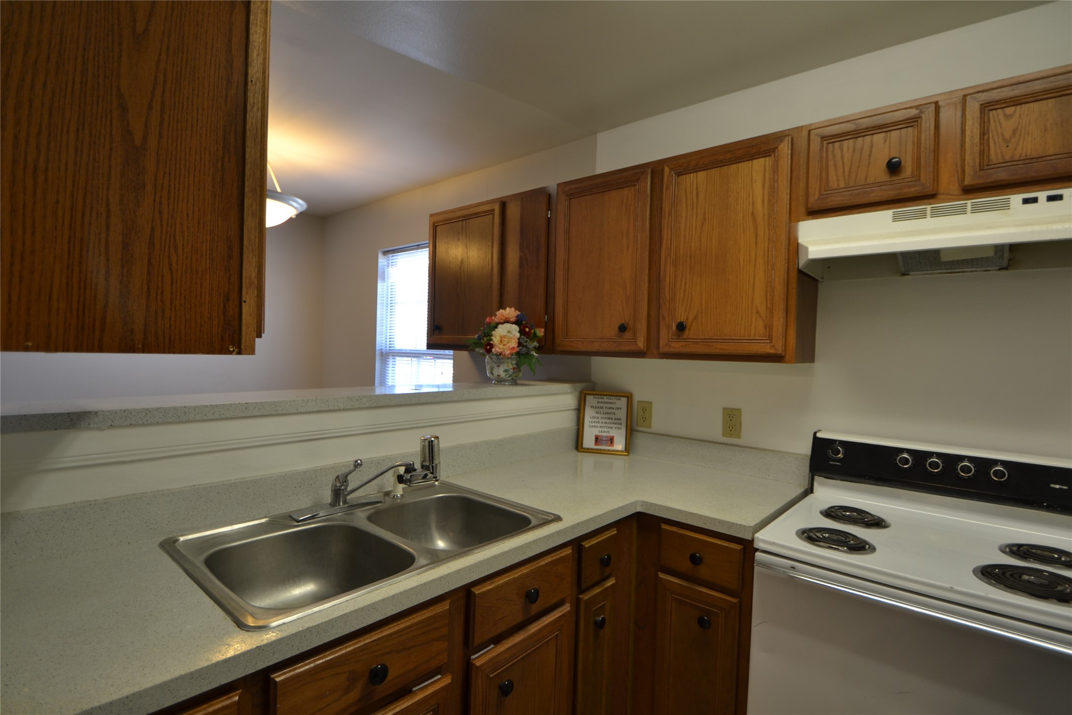 304 Dell Court, Unit 7 Houston, TX 77009 - Photo 22 of 36 a kitchen with a sink and cabinets