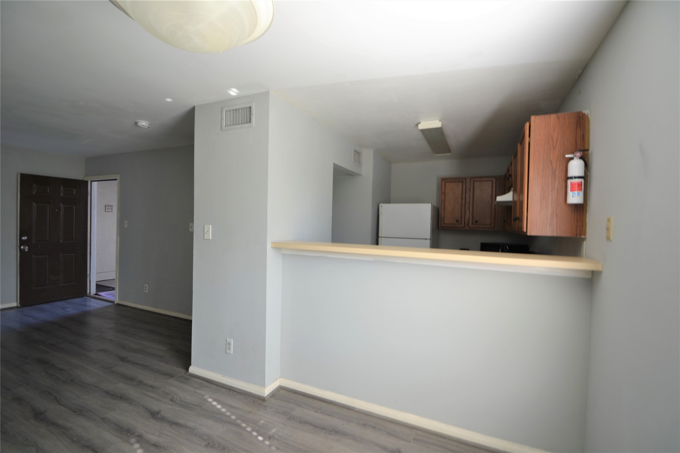 304 Dell Court, Unit 7 Houston, TX 77009 - Photo 31 of 36 a view of a hallway with wooden floor