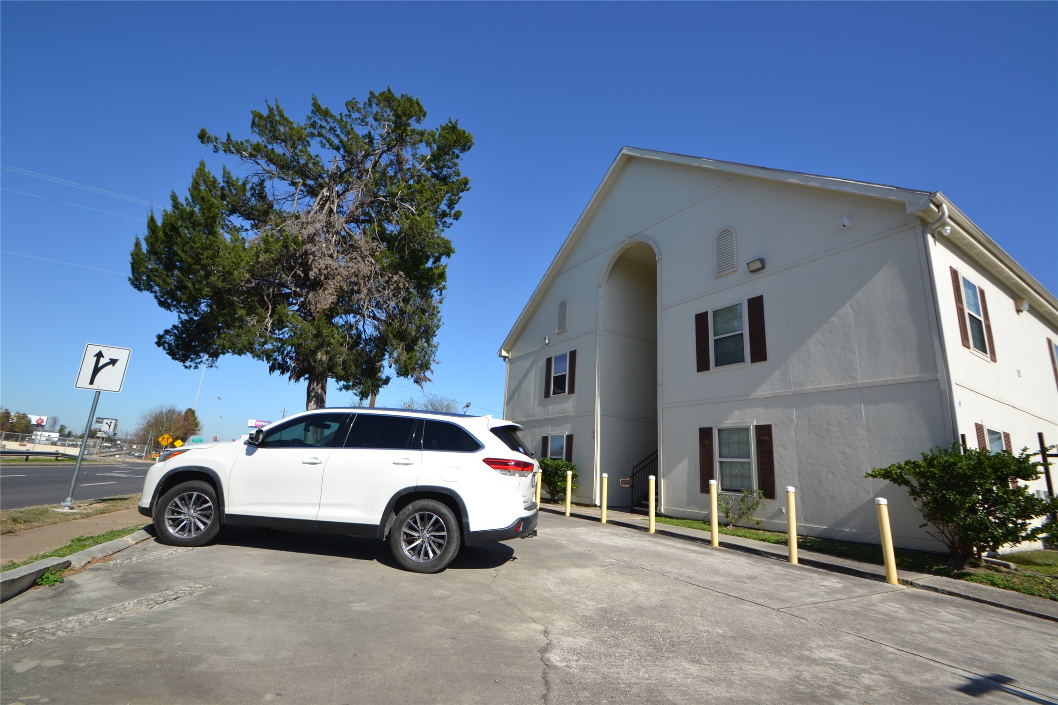 304 Dell Court, Unit 7 Houston, TX 77009 - Photo 7 of 36 a view of a car parked in front of a house