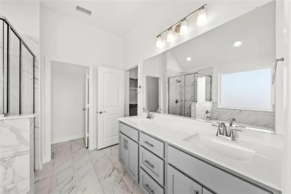 a spacious bathroom with a double vanity sink mirror and