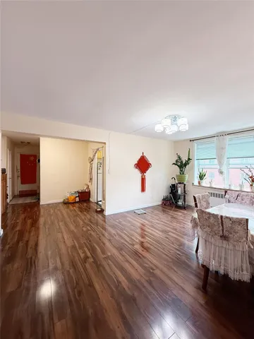 a view of a livingroom with furniture and wooden floor