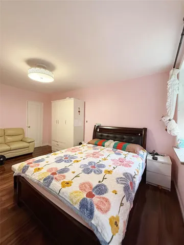 a bedroom with bed and window