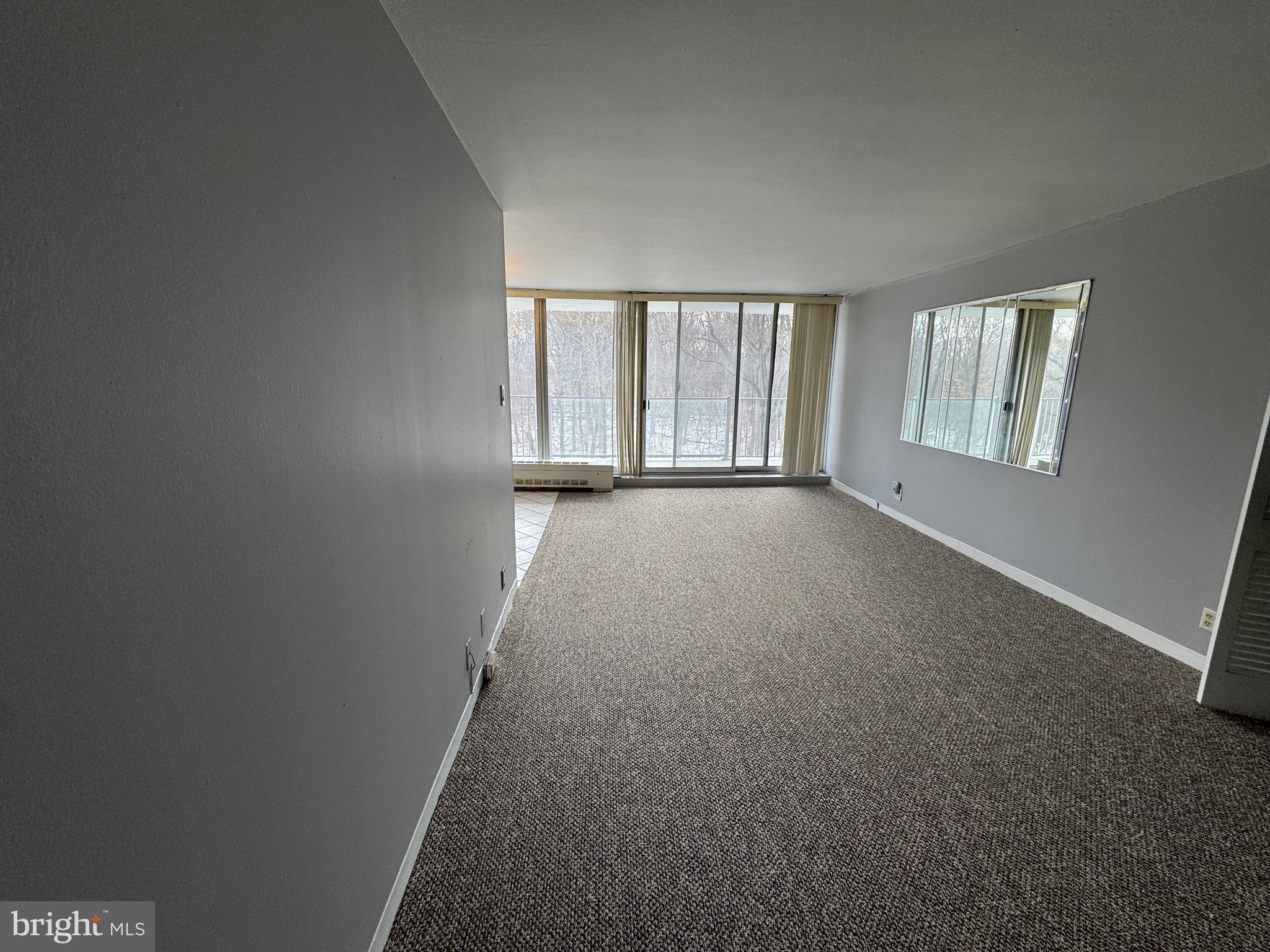 3900 West Ford Road, Unit 5M Philadelphia, PA 19131 - Photo 11 of 23 an empty room with windows