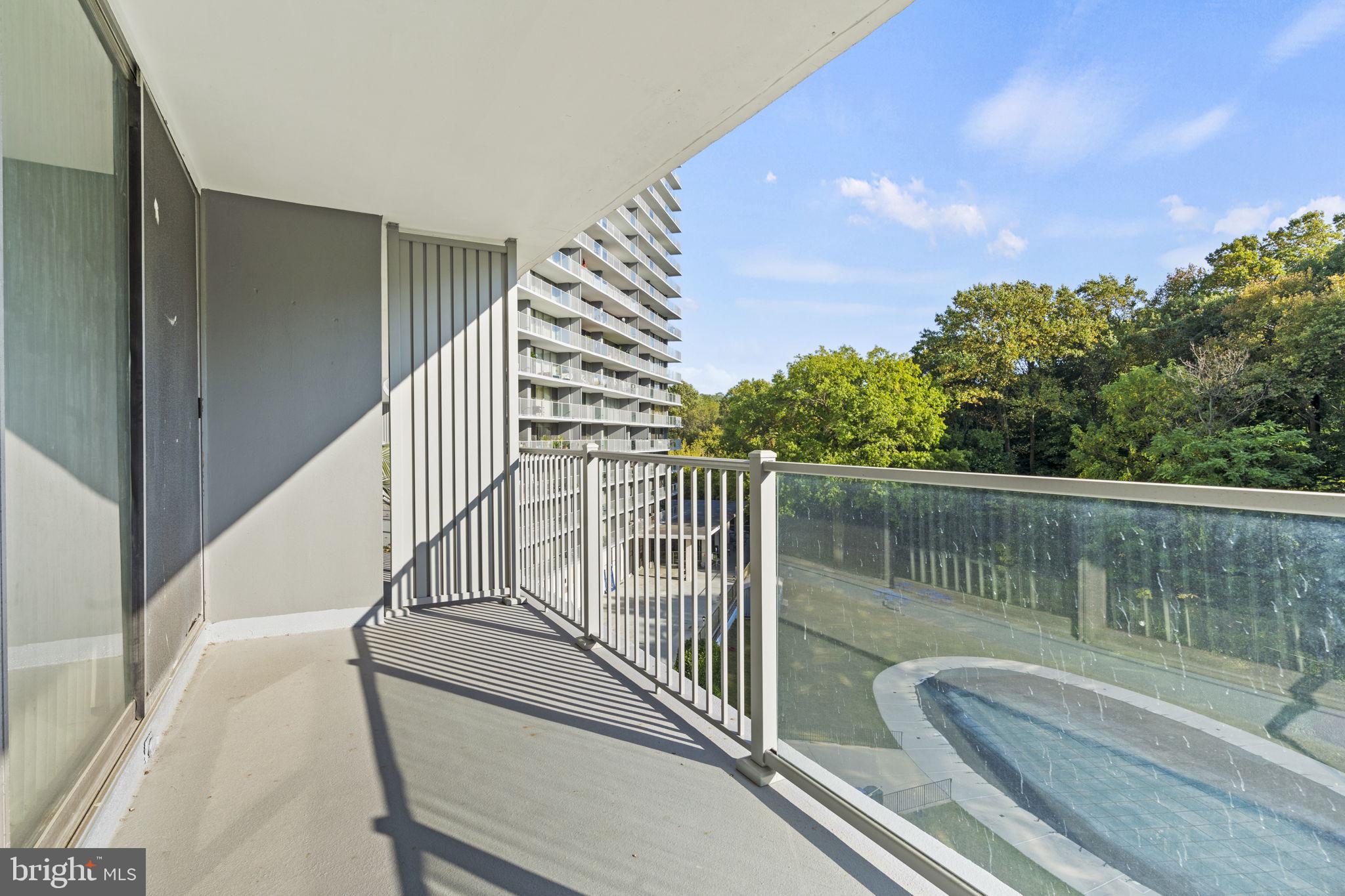 3900 West Ford Road, Unit 5M Philadelphia, PA 19131 - Photo 16 of 23 a view of balcony with wooden floor and fence