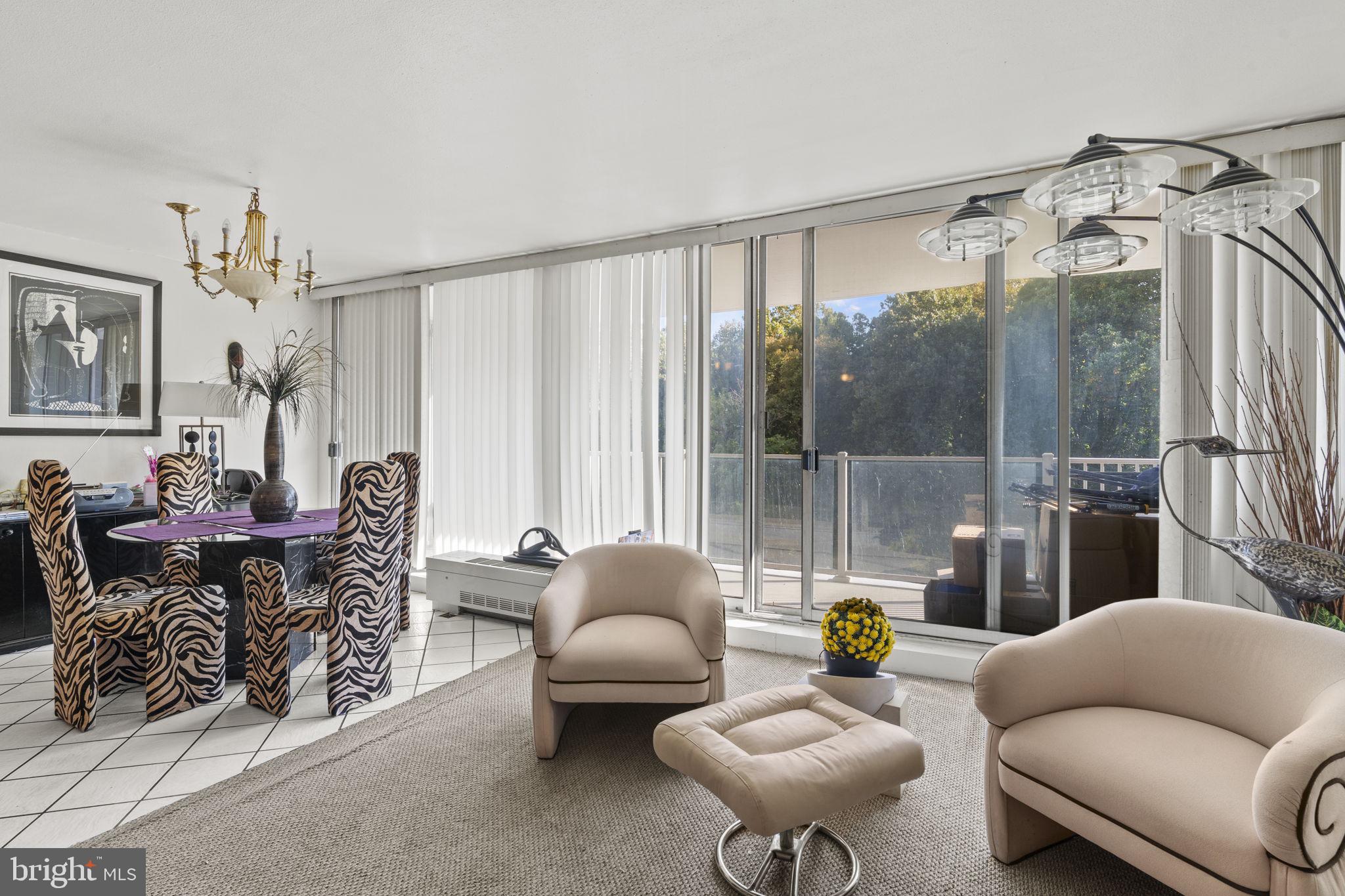 3900 West Ford Road, Unit 5M Philadelphia, PA 19131 - Photo 6 of 23 a living room with furniture and a large window