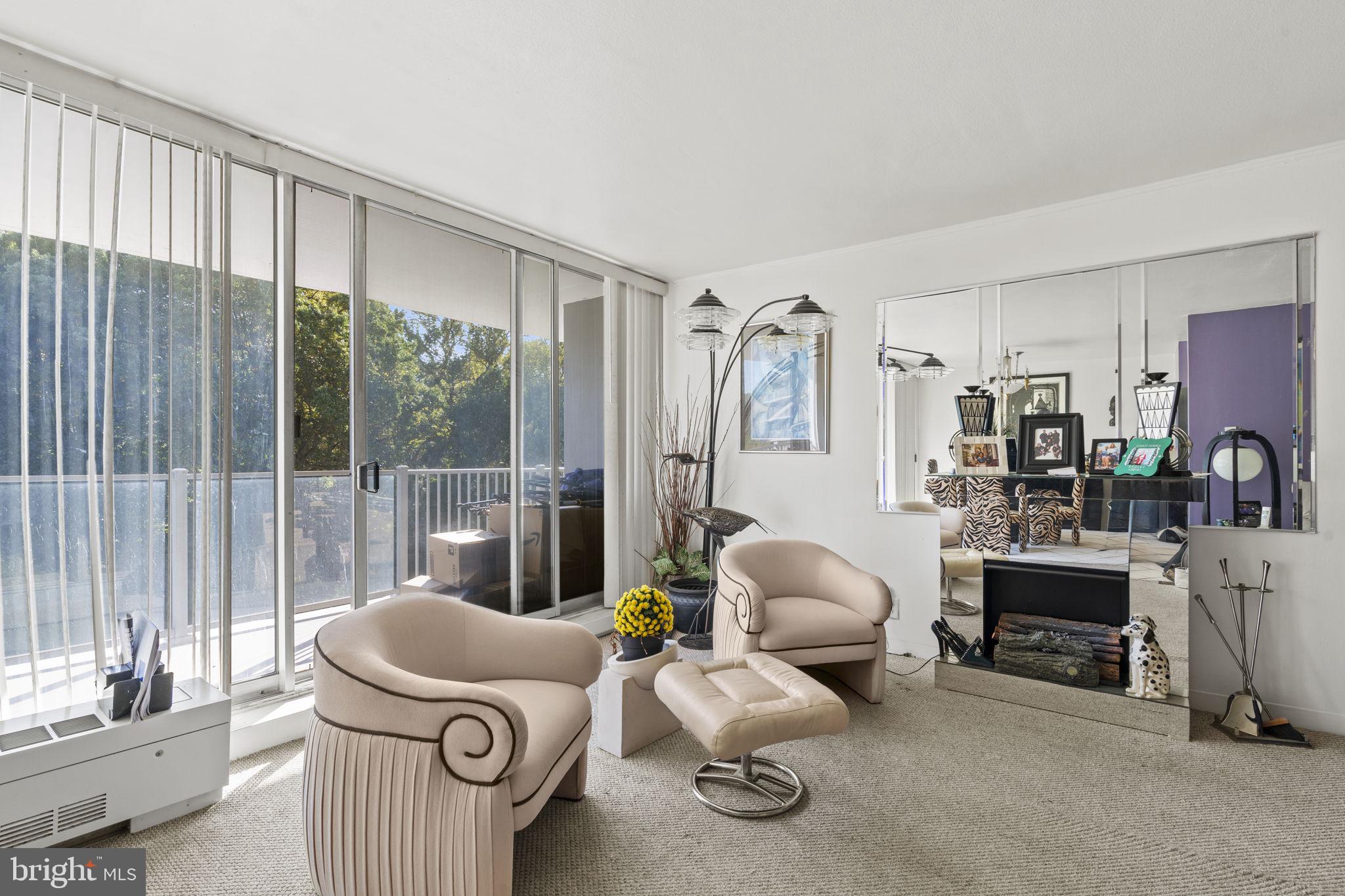 3900 West Ford Road, Unit 5M Philadelphia, PA 19131 - Photo 8 of 23 a living room with furniture and a large window