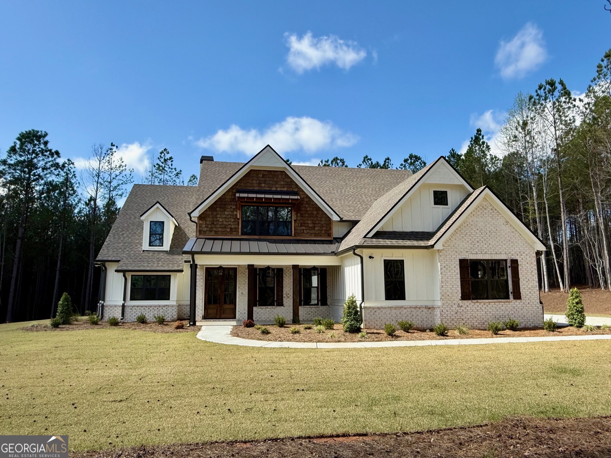 196 Bob Smith Road Sharpsburg, GA 30277 - Photo 1 of 68 a front view of a house with a yard